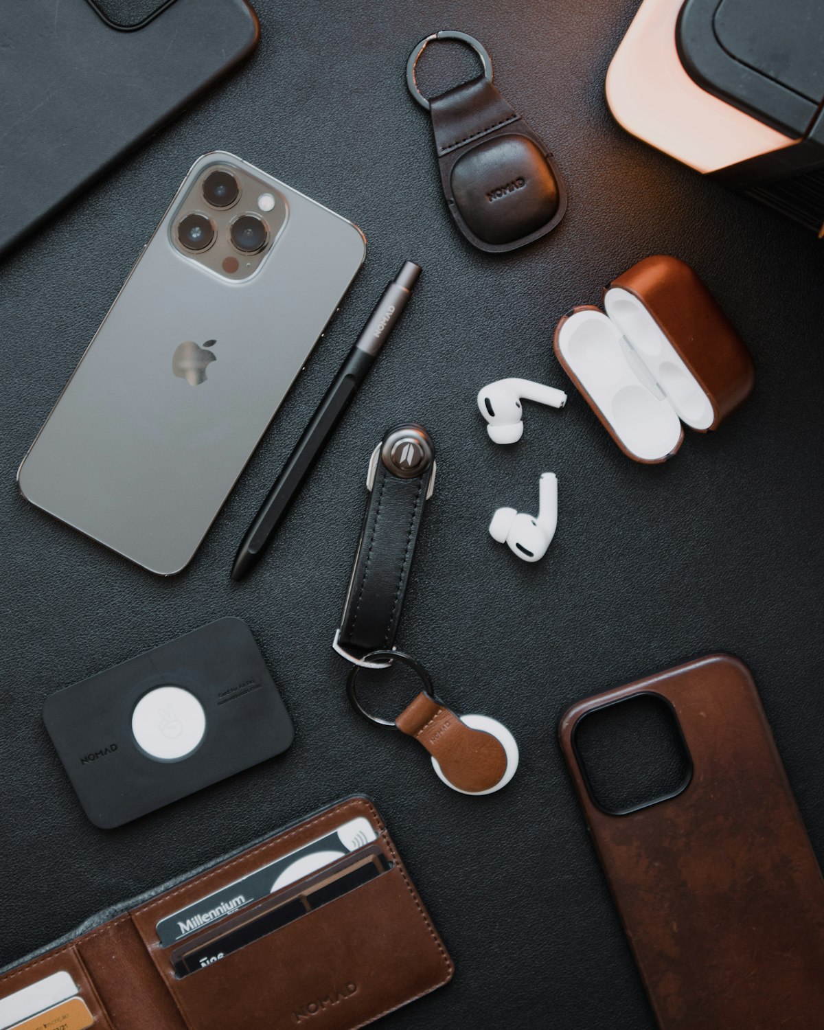 Illustrative smartphone and accessories photographed on a light surface