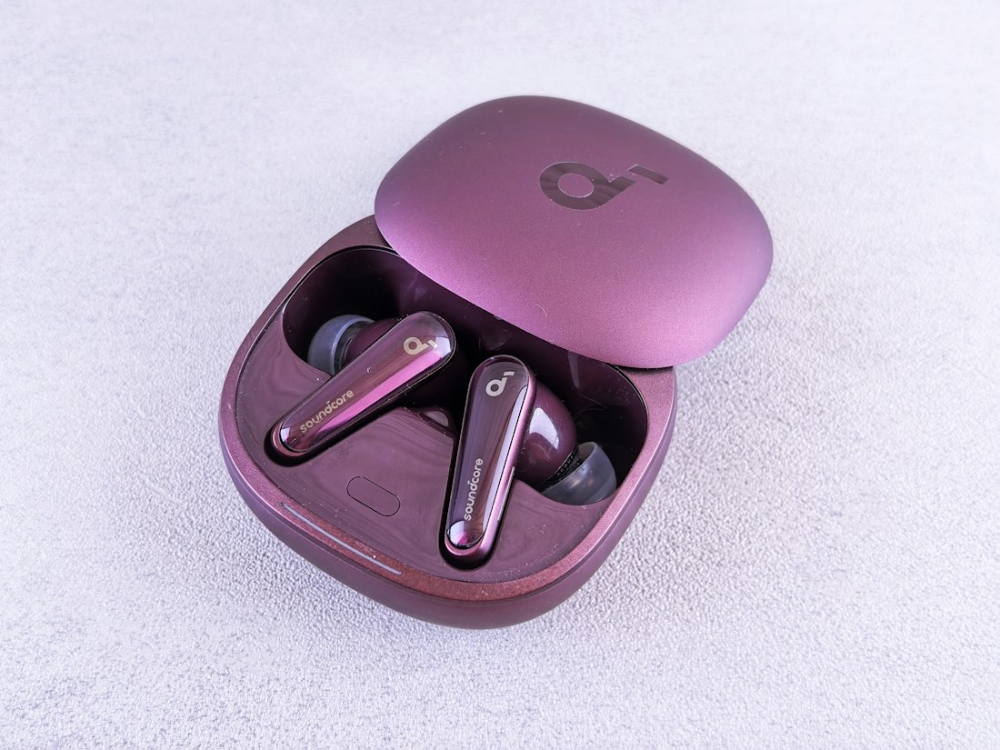 Wireless earbuds displayed with a charging case